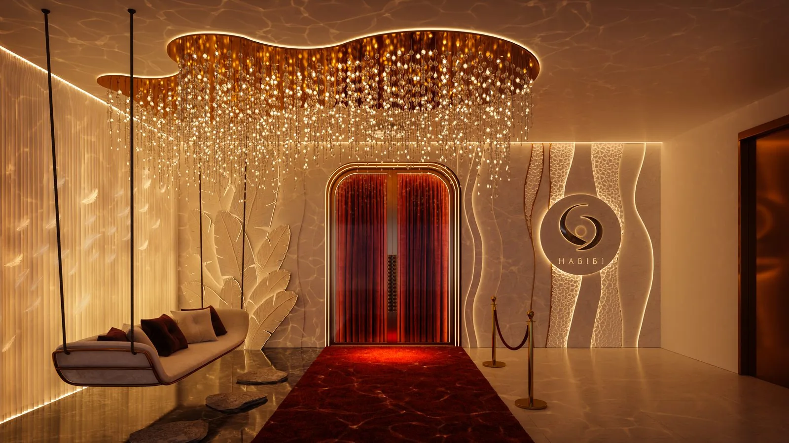 Vstup do restaurace HABIBI - křišťálový lustr, červený koberec a nasvícené logo HABIBI