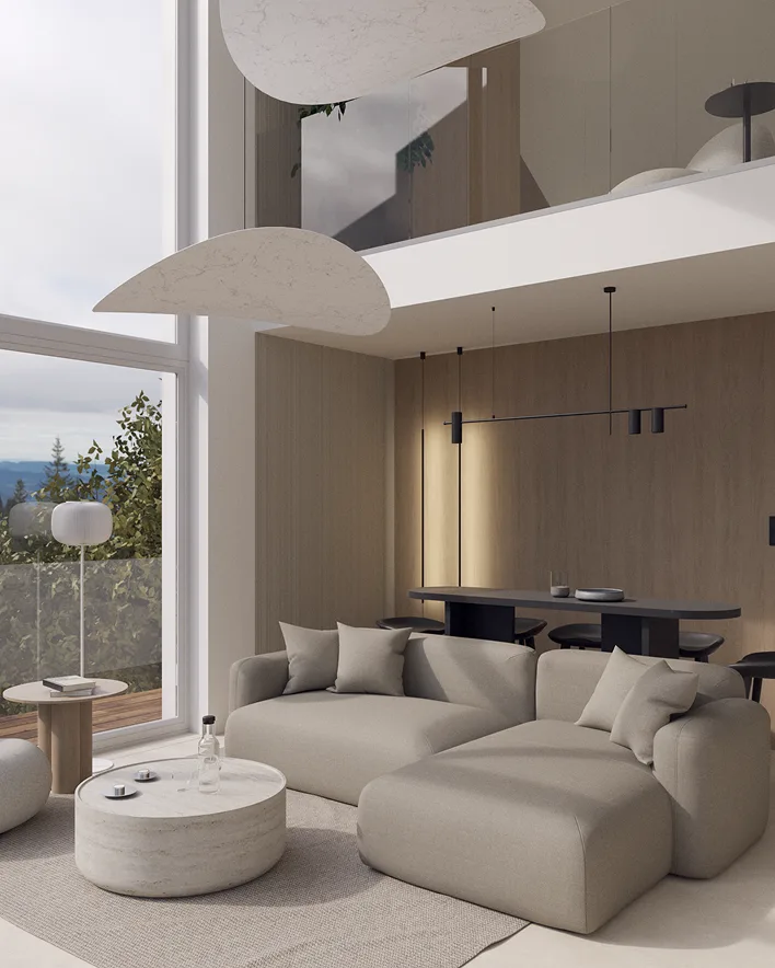 Jasny, nowoczesny salon w willi Treesna z wysokim sufitem, dużymi przeszkleniami i widokiem na naturę. Wnętrze urządzone w minimalistycznym stylu z beżową sofą, okrągłym stolikiem i jadalnią w tle.